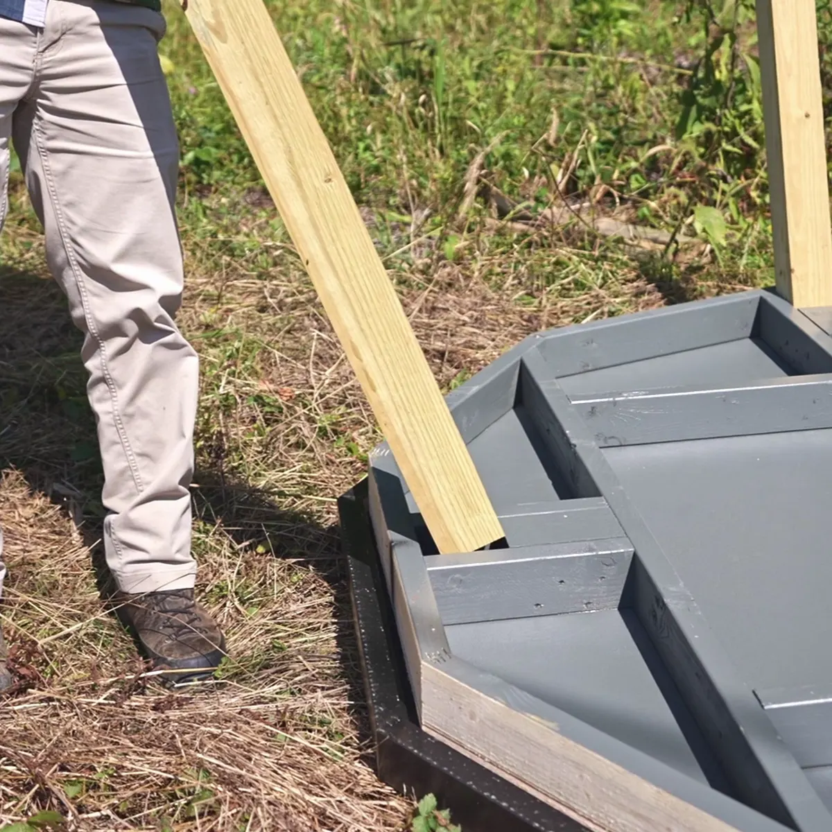 A tower leg dropping into a post pocket in the floor.